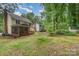 Expansive backyard with a well-maintained lawn and mature trees, perfect for outdoor activities and relaxation at 10606 Danesway Ln, Cornelius, NC 28031