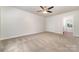 Comfortable bedroom with new carpeting, a ceiling fan, and ample closet space at 10606 Danesway Ln, Cornelius, NC 28031