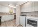 Convenient laundry area with white cabinetry and modern washer and dryer at 10606 Danesway Ln, Cornelius, NC 28031