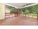 Enjoy outdoor living on this screened porch overlooking the backyard surrounded by lush greenery at 10606 Danesway Ln, Cornelius, NC 28031