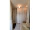 Well-lit bathroom featuring built-in cabinet, shower with glass door, and tile flooring at 110 Kimberly Ln, Kings Mountain, NC 28086