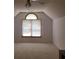 Bright bedroom featuring neutral carpet, sloped ceilings, and a window for natural light at 110 Kimberly Ln, Kings Mountain, NC 28086