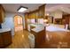 Well-equipped kitchen with wood floors, classic cabinets, and an open layout to the living spaces at 110 Kimberly Ln, Kings Mountain, NC 28086