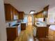Well-lit kitchen showcasing modern appliances, ample wood cabinetry, and an eat-in bar area at 110 Kimberly Ln, Kings Mountain, NC 28086