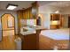 A wide view of the kitchen featuring an eat-in bar, wooden cabinets, and a bright layout at 110 Kimberly Ln, Kings Mountain, NC 28086