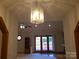 Bright and airy living area with access to outdoor space and a stylish light fixture at 110 Kimberly Ln, Kings Mountain, NC 28086