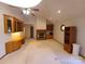 A sunlit living room with a fireplace, built-in shelving, and a classic ceiling fan at 110 Kimberly Ln, Kings Mountain, NC 28086
