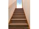 Carpeted staircase with wooden banister leading to the upper level at 110 Kimberly Ln, Kings Mountain, NC 28086