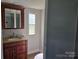 A charming bathroom features a granite countertop, and a vanity at 1150 Wyatt Grove Church Rd, Gold Hill, NC 28071