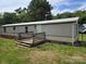 Exterior view of home featuring a small front porch and satellite dish at 1150 Wyatt Grove Church Rd, Gold Hill, NC 28071