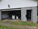 Interior view of a two car garage with an open door to the backyard at 1150 Wyatt Grove Church Rd, Gold Hill, NC 28071