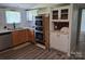 Well-lit kitchen with stainless steel appliances, wooden cabinets, and modern countertops at 1150 Wyatt Grove Church Rd, Gold Hill, NC 28071