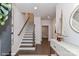 Bright foyer with staircase and hardwood floors, complemented by stylish decor and an open entryway leading to other rooms at 122 Wesser St # 14, Davidson, NC 28036