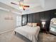 Bedroom featuring a ceiling fan, a large bed, and modern decor at 12320 Verdant Ct, Charlotte, NC 28273