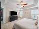 Bedroom featuring a large bed, a dresser, and a bright sunny window at 12320 Verdant Ct, Charlotte, NC 28273