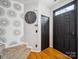 Front entryway featuring stylish wallpaper and dark accents at 12320 Verdant Ct, Charlotte, NC 28273