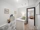 Bright hallway showcasing neutral walls, stylish decor, and a glimpse into an inviting bedroom at 12320 Verdant Ct, Charlotte, NC 28273