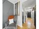 Hallway featuring hardwood floors and fresh neutral paint at 12320 Verdant Ct, Charlotte, NC 28273