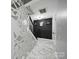 Hallway with unique decorative mirror and contemporary accents at 12320 Verdant Ct, Charlotte, NC 28273
