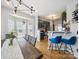 Modern kitchen featuring stainless steel appliances, stylish dark cabinets, and a breakfast bar with seating at 12320 Verdant Ct, Charlotte, NC 28273