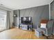 Stylish living room with hardwood floors, a decorative wall, and modern furnishings at 12320 Verdant Ct, Charlotte, NC 28273