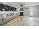 Inviting living room with modern fireplace, neutral decor, and fan at 12320 Verdant Ct, Charlotte, NC 28273