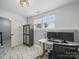 Home office with built-in desk, cabinet, and bright natural light at 12320 Verdant Ct, Charlotte, NC 28273