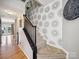 Carpeted staircase with decorative wallpaper at 12320 Verdant Ct, Charlotte, NC 28273