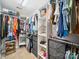Organized walk-in closet features shelving, hanging rods, and built-in storage, maximizing space and convenience at 12320 Verdant Ct, Charlotte, NC 28273