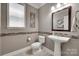Cozy half bathroom with a modern sink and stylish accents at 1241 Brough Hall Dr, Waxhaw, NC 28173