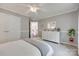 Bright bedroom with ceiling fan, white dresser, and plant, offering a cozy and inviting space at 1241 Brough Hall Dr, Waxhaw, NC 28173