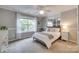 Bedroom with neutral walls, carpet, and a large window at 1241 Brough Hall Dr, Waxhaw, NC 28173