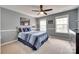 Bedroom with natural light, ceiling fan, and tastefully coordinated decor, creating a relaxing atmosphere at 1241 Brough Hall Dr, Waxhaw, NC 28173
