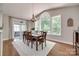 Dining room with hardwood floors and large windows providing natural light at 1241 Brough Hall Dr, Waxhaw, NC 28173