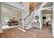 Elegant foyer with hardwood floors, a staircase, and views of the dining and living areas, showcasing a spacious layout at 1241 Brough Hall Dr, Waxhaw, NC 28173