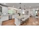 Open concept kitchen with a view into dining room, featuring an island with seating at 1241 Brough Hall Dr, Waxhaw, NC 28173