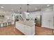 Open concept kitchen with large center island and stainless steel refrigerator at 1241 Brough Hall Dr, Waxhaw, NC 28173