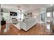 Spacious living room featuring a fireplace, hardwood floors, and neutral tones, perfect for Gathering gatherings at 1241 Brough Hall Dr, Waxhaw, NC 28173