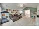 Spacious living area with patterned accent wall, treadmill, and access to upstairs landing at 1241 Brough Hall Dr, Waxhaw, NC 28173