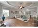 Bright living room with hardwood floors, neutral paint, and a ceiling fan at 1241 Brough Hall Dr, Waxhaw, NC 28173