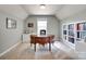 Home office with a classic desk, ample shelving, and bright natural light, perfect for productivity at 1241 Brough Hall Dr, Waxhaw, NC 28173