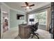 Well-lit office featuring a large window, a wooden desk, and a comfortable chair, designed for productivity at 1241 Brough Hall Dr, Waxhaw, NC 28173