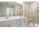 Modern bathroom with double vanity, sleek hardware, and frameless glass shower at 125 Cedar Knoll Cir, Pineville, NC 28134