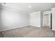 Bright, airy bedroom featuring neutral paint and soft carpeting at 125 Cedar Knoll Cir, Pineville, NC 28134