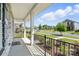 A view from porch shows manicured lawn and landscaping plus neighborhood street at 125 Cedar Knoll Cir, Pineville, NC 28134