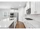 Modern kitchen featuring quartz countertops, gas range, and stainless steel appliances at 125 Cedar Knoll Cir, Pineville, NC 28134