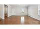 Bright, open living room with hardwood floors, and neutral paint at 125 Cedar Knoll Cir, Pineville, NC 28134