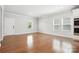 Bright living room features hardwood floors, recessed lighting, and natural light from large windows at 125 Cedar Knoll Cir, Pineville, NC 28134