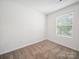 This bedroom boasts natural light, carpet, and white walls, awaiting personal touches to make it home at 125 Fosters Glen Pl, Mooresville, NC 28115