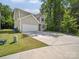 Charming two-story home with a wide driveway and a two-car garage at 125 Fosters Glen Pl, Mooresville, NC 28115